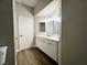 Bathroom with modern vanity, updated fixtures, and neutral color scheme at 5263 Shasta Lake Way, Las Vegas, NV 89118