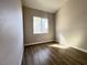 Cozy bedroom featuring wood flooring, natural light, and neutral paint at 5263 Shasta Lake Way, Las Vegas, NV 89118