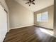 Comfortable bedroom featuring wood flooring and a large window at 5263 Shasta Lake Way, Las Vegas, NV 89118