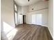 Spacious bedroom with vaulted ceiling, wood floors, and ample closet space at 5263 Shasta Lake Way, Las Vegas, NV 89118