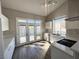 Bright, remodeled kitchen with white cabinets, quartz countertops, and stainless steel appliances at 5263 Shasta Lake Way, Las Vegas, NV 89118
