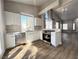 Modern kitchen with white cabinetry, stainless steel appliances, and a bright window at 5263 Shasta Lake Way, Las Vegas, NV 89118
