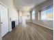Bright living room with a fireplace and wood floors flowing into the open-concept kitchen at 5263 Shasta Lake Way, Las Vegas, NV 89118