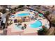 Aerial view of the community pool featuring separate pools and shade structures at 5555 E San Pietro Dr, Pahrump, NV 89061