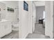 Well-lit bathroom with a sleek white vanity and shower, seamlessly connecting to the bedroom at 5555 E San Pietro Dr, Pahrump, NV 89061