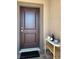 Stylish front door with modern hardware, complementing the home's neutral exterior at 5555 E San Pietro Dr, Pahrump, NV 89061
