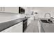 Stylish modern kitchen with stainless appliances, dark countertops, and lots of storage at 5555 E San Pietro Dr, Pahrump, NV 89061