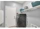 Functional laundry room with modern appliances, ample storage, and a clean, organized layout at 5555 E San Pietro Dr, Pahrump, NV 89061