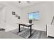 Bright home office with sleek flooring, a modern ceiling fan, and a comfortable workspace at 5555 E San Pietro Dr, Pahrump, NV 89061