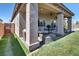 Covered patio with stylish seating, an outdoor kitchen with a grill, and a clear view of the backyard at 5555 E San Pietro Dr, Pahrump, NV 89061