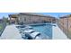 Inviting backyard pool area with lounge chairs and a hot tub perfect for relaxing and entertaining at 5555 E San Pietro Dr, Pahrump, NV 89061
