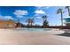 Beautiful community pool with palm trees and shade, perfect for relaxation at 5555 E San Pietro Dr, Pahrump, NV 89061