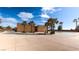 Inviting community pool area with palm trees, lounge chairs, and clear blue water at 5555 E San Pietro Dr, Pahrump, NV 89061