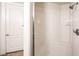 Bathroom featuring a walk-in shower and a door leading to the rest of the home at 56 E Serene Ave # 306, Las Vegas, NV 89123