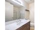 Bright bathroom featuring a large mirror, shower, and a vanity with a white countertop at 56 E Serene Ave # 306, Las Vegas, NV 89123