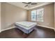 Bedroom featuring hardwood floors, a ceiling fan, and natural light streaming through a window at 56 E Serene Ave # 306, Las Vegas, NV 89123