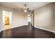 Bedroom boasting wood floors, neutral walls, a ceiling fan, and access to closet at 56 E Serene Ave # 306, Las Vegas, NV 89123
