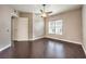 Bedroom featuring wood floors, neutral toned walls, a ceiling fan, and a window view at 56 E Serene Ave # 306, Las Vegas, NV 89123