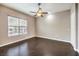 Bedroom featuring dark wood floors, a ceiling fan, natural light and neutral toned walls at 56 E Serene Ave # 306, Las Vegas, NV 89123