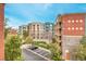Exterior showcasing the complex buildings, landscaping, and parking at 56 E Serene Ave # 306, Las Vegas, NV 89123
