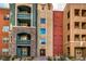 Multi-story building complex with various balconies and eye-catching colorful architectural styles at 56 E Serene Ave # 306, Las Vegas, NV 89123