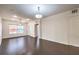 Open living space with hardwood floors, ceiling fan, and neutral walls at 56 E Serene Ave # 306, Las Vegas, NV 89123