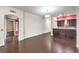 Spacious living room with hardwood floors, archway details, and seamless flow to the kitchen at 56 E Serene Ave # 306, Las Vegas, NV 89123