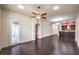 Inviting living room with hardwood floors, access to a balcony, and an adjacent kitchen area at 56 E Serene Ave # 306, Las Vegas, NV 89123