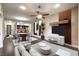 Bright, open-concept living space with modern furniture, dining area, and a view of the kitchen at 56 E Serene Ave # 306, Las Vegas, NV 89123