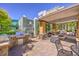 Inviting outdoor area with a built-in grill, comfortable seating, and a cozy fire pit at 56 E Serene Ave # 306, Las Vegas, NV 89123