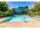 Beautiful pool area with deck-mounted seating, with nearby trees that enhance the atmosphere at 56 E Serene Ave # 306, Las Vegas, NV 89123