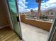 View from balcony overlooking neighborhood homes and blue skies at 566 Shewsbury Ave, Las Vegas, NV 89178