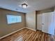 Bright bedroom features wood-look floors, a closet and a window with natural light at 566 Shewsbury Ave, Las Vegas, NV 89178