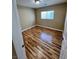 Cozy bedroom with natural light, wood-look floors and a serene, comfortable atmosphere at 566 Shewsbury Ave, Las Vegas, NV 89178