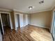 Spacious bedroom with wood-look floors, dual closets and a sliding glass door for backyard access at 566 Shewsbury Ave, Las Vegas, NV 89178
