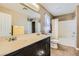 Bright bathroom featuring a double sink vanity, toilet, and shower-tub combo at 5916 Sierra Cliff St, North Las Vegas, NV 89031