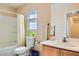 Bright bathroom features a shower-tub combo with a single sink vanity at 5916 Sierra Cliff St, North Las Vegas, NV 89031