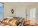 Cozy bedroom featuring wood floors, closet, and neutral tones at 5916 Sierra Cliff St, North Las Vegas, NV 89031