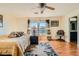 Bright bedroom with hardwood floors, ceiling fan, and two windows for natural light at 5916 Sierra Cliff St, North Las Vegas, NV 89031