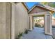 Covered front entry with supporting columns and a walkway, offering shelter and curb appeal at 5916 Sierra Cliff St, North Las Vegas, NV 89031
