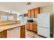 Bright kitchen showcases wood cabinets, white appliances, and neutral countertops for a cozy meal preparation area at 5916 Sierra Cliff St, North Las Vegas, NV 89031