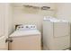 Practical laundry area with washer and dryer hookups and storage at 5916 Sierra Cliff St, North Las Vegas, NV 89031