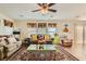 Inviting living room boasts comfortable seating, a ceiling fan, and natural light at 5916 Sierra Cliff St, North Las Vegas, NV 89031