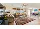 Cozy living room with tile floors, comfortable seating, and a ceiling fan for added comfort at 5916 Sierra Cliff St, North Las Vegas, NV 89031