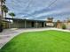 Well-maintained backyard featuring artificial grass and privacy fence at 604 N Minnesota St, Las Vegas, NV 89107