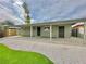 Backyard featuring desert landscaping and an extended covered patio at 604 N Minnesota St, Las Vegas, NV 89107
