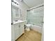 Bathroom featuring a shower/tub combo, a vanity, and light wood-look flooring at 604 N Minnesota St, Las Vegas, NV 89107