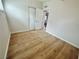 This bedroom features wood floors, a double-door closet, and neutral paint at 604 N Minnesota St, Las Vegas, NV 89107