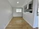 Bright dining area with laminate wood flooring and a view of the kitchen at 604 N Minnesota St, Las Vegas, NV 89107