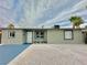 Clean front exterior with blue accents and gravel landscaping at 604 N Minnesota St, Las Vegas, NV 89107